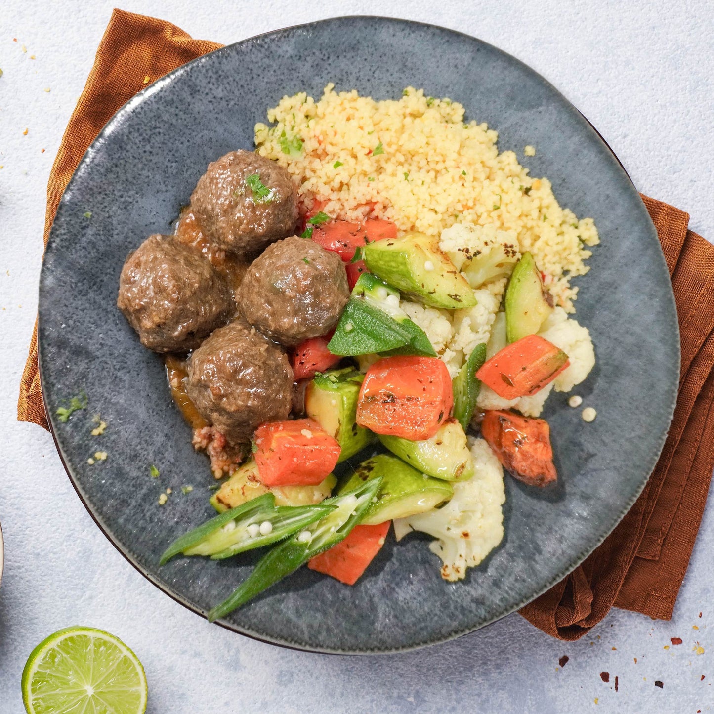 B. Moroccan Braised Meatballs, Roasted Vegetable And Chickpeas Cous Cous Mix Rice