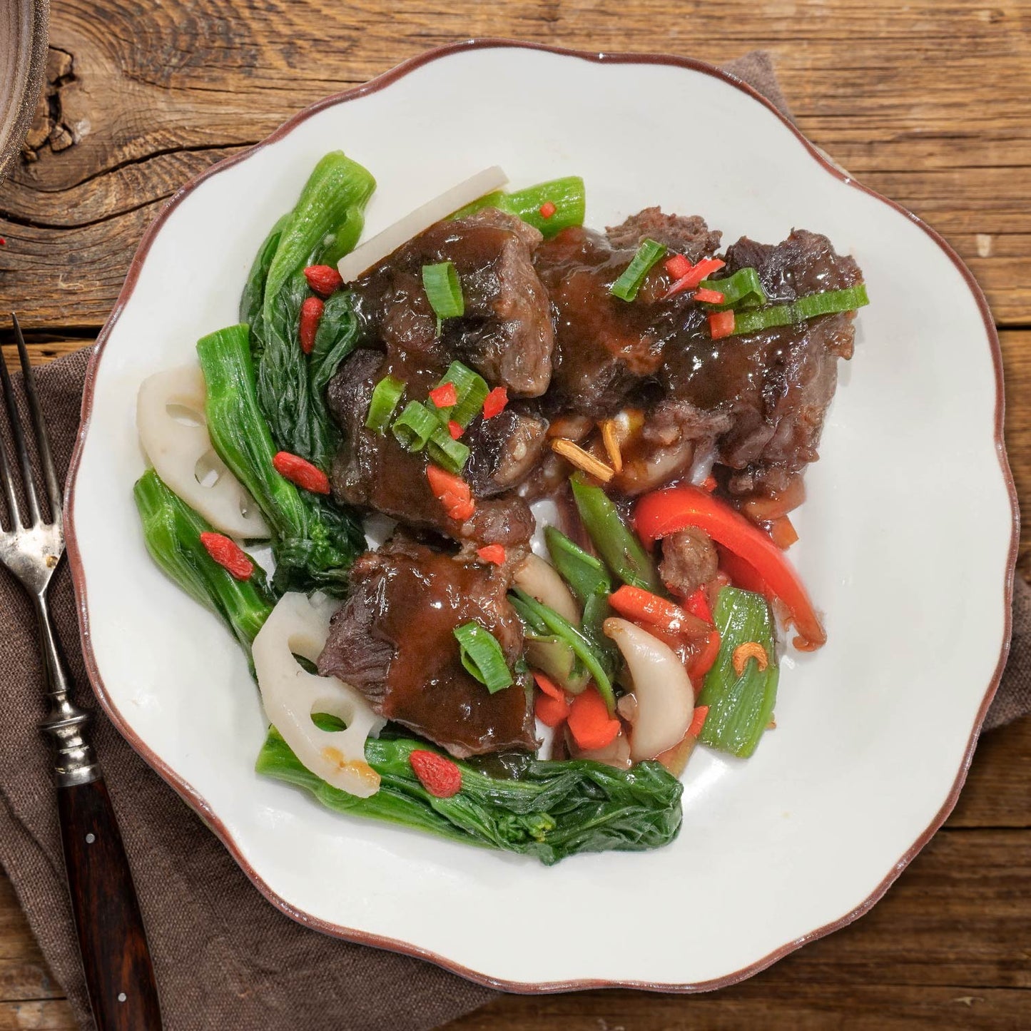 D. Chu Hou Braised Beef Cheek W/ Seasonal Greens And Vegetable Rice