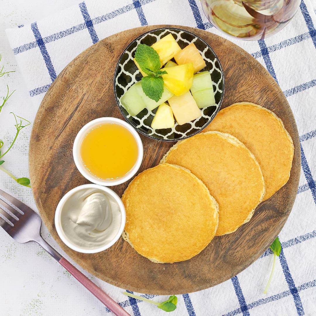 Quinoa Pancakes W/ Maple Syrup, Vanilla Cream and Fruit Salad