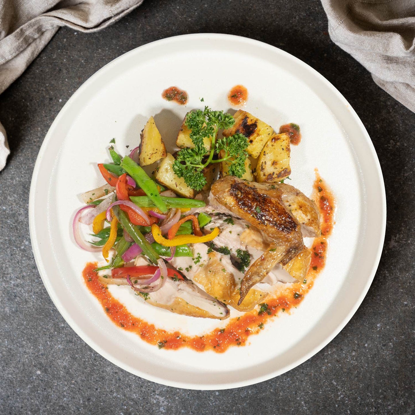 Grilled Spring Chicken W/ Garlic Potatoes, Garden Vegetables And Pesto Sauce