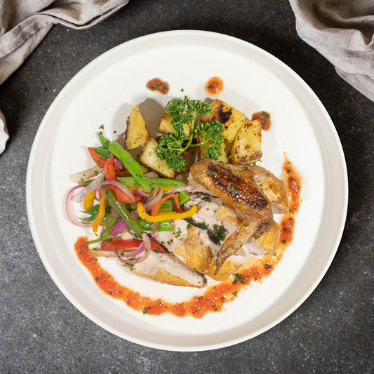 Grilled Spring Chicken W/ Garlic Potatoes, Garden Vegetables And Pesto Sauce