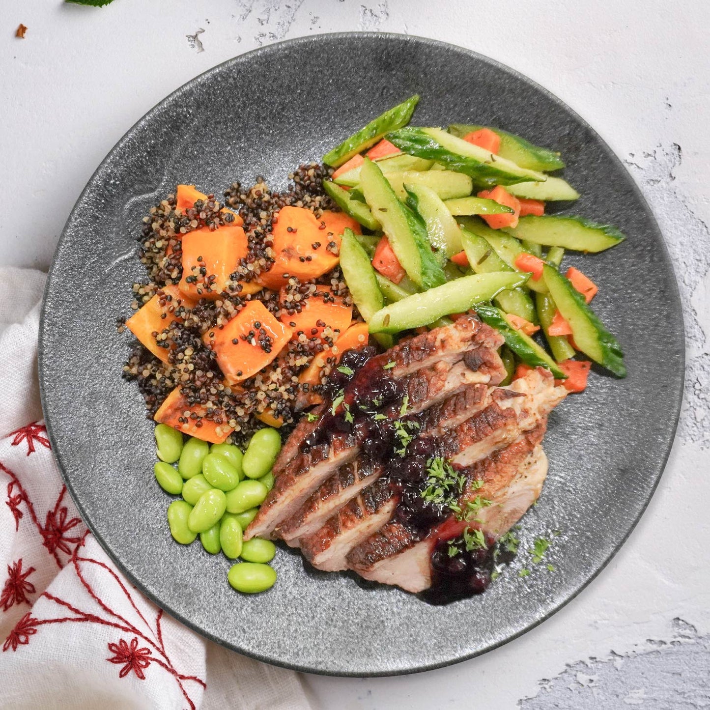 B. Grilled Duck Breast W/ Mixed Berry Balsamic Reduction And Organic Quinoa Pumpkin Mix Rice