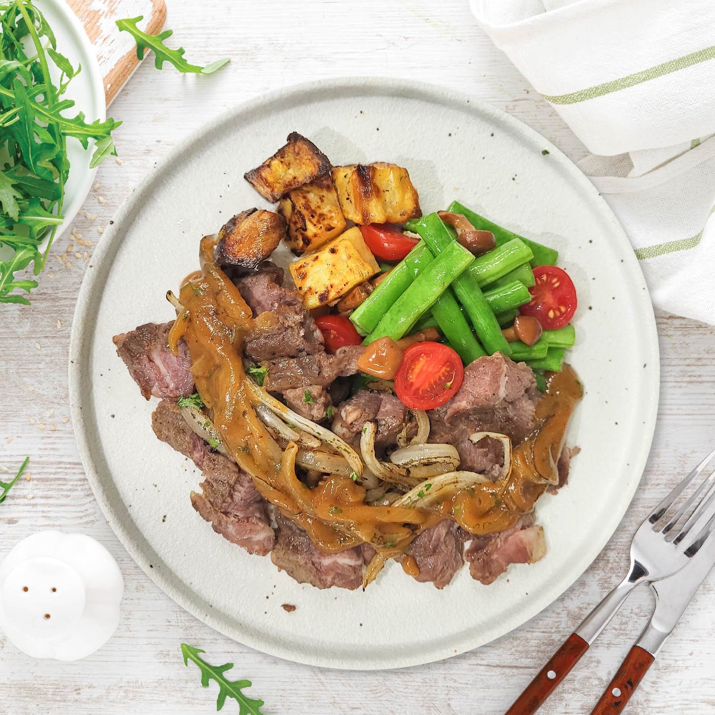Rib Eye Steak W/ Onion Sauce And Seasonal Greens