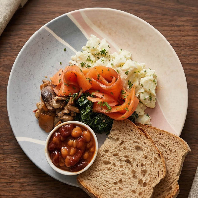Fittery signature Norwegian salmon with egg whites and homemade baked beans served on a plate.