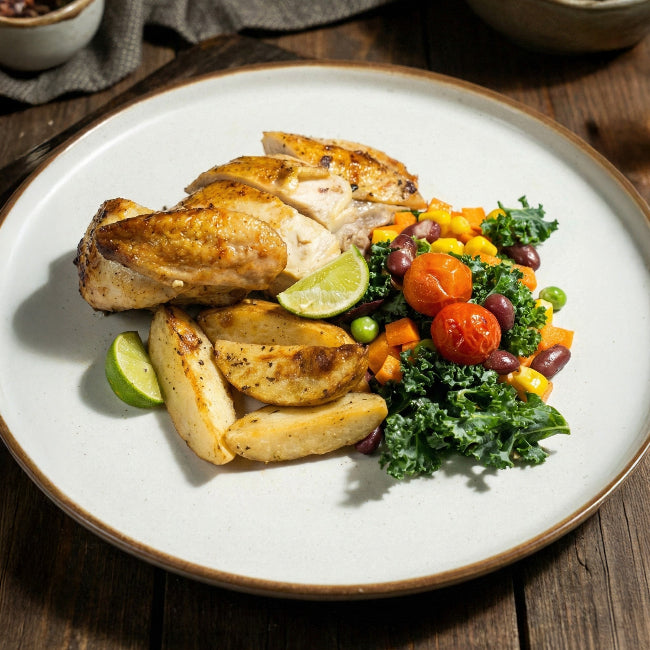 Grilled garlic lemon thyme chicken breast served with seasonal greens and warm English potato salad, Fittery signature meal.