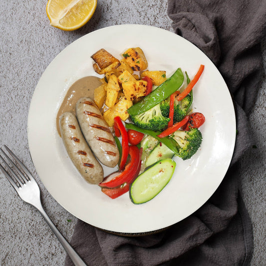 B. Grilled Veal Sausages W/ Sautee Vegetables, Baked Sweet Potato And Mushroom Sauce