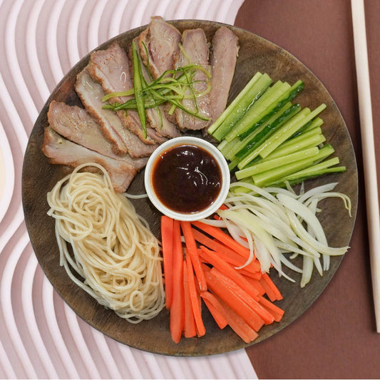 D. Healthy Peking Duck W/ Seasonal Vegetables and Asian Noodles