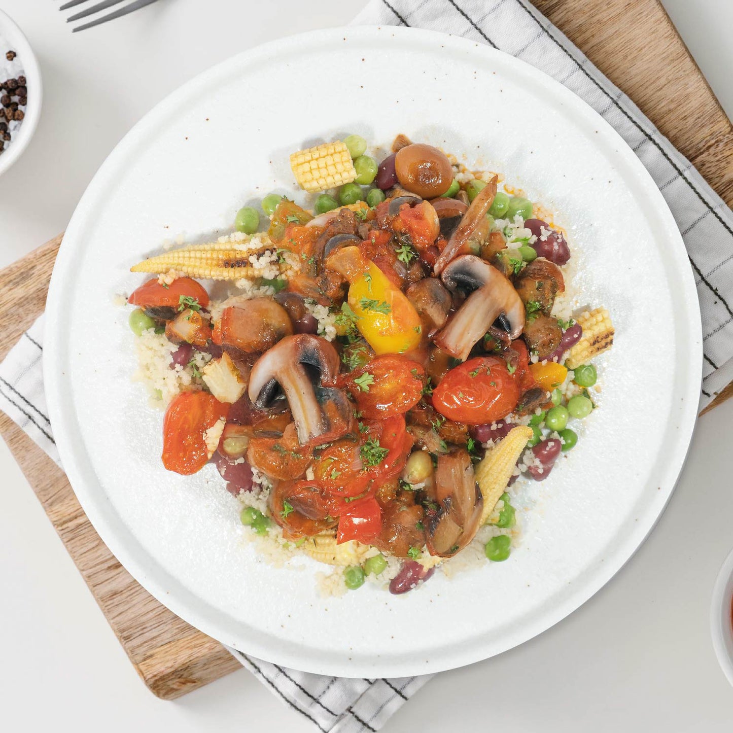 A. Spanish Mushroom and Chickpea Paella W/ Seasonal Vegetables And Quinoa Mix Cous Cous Rice