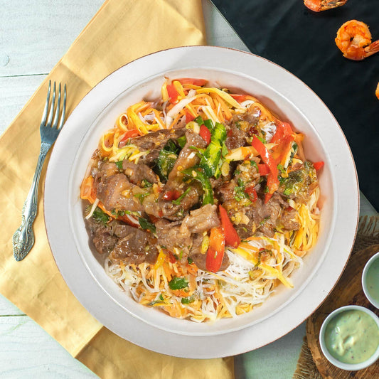 A. Saigon Shaking Beef W/ Stir Fry Vegetables And Rice Noodles