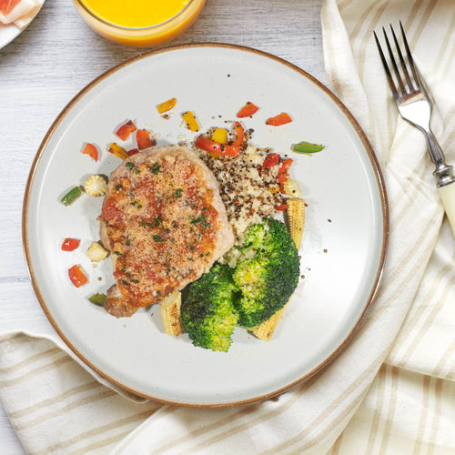Oven Baked Pork Loin Milanese Served W/ Roast Vegetables And Italian Quinoa Cous Cous
