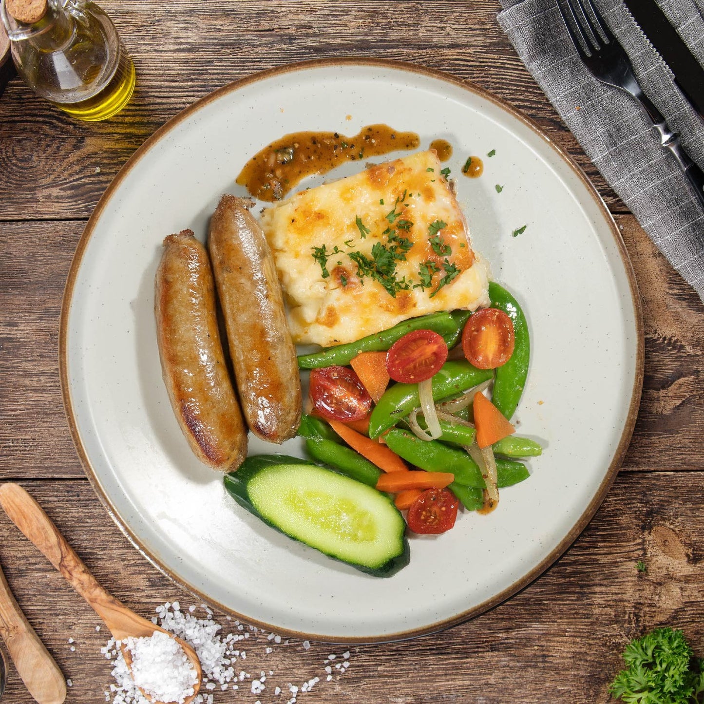 A. Country Beef Sausage W/ Potato Scallopine, Sauteed Vegetables And Peppercorn Sauce