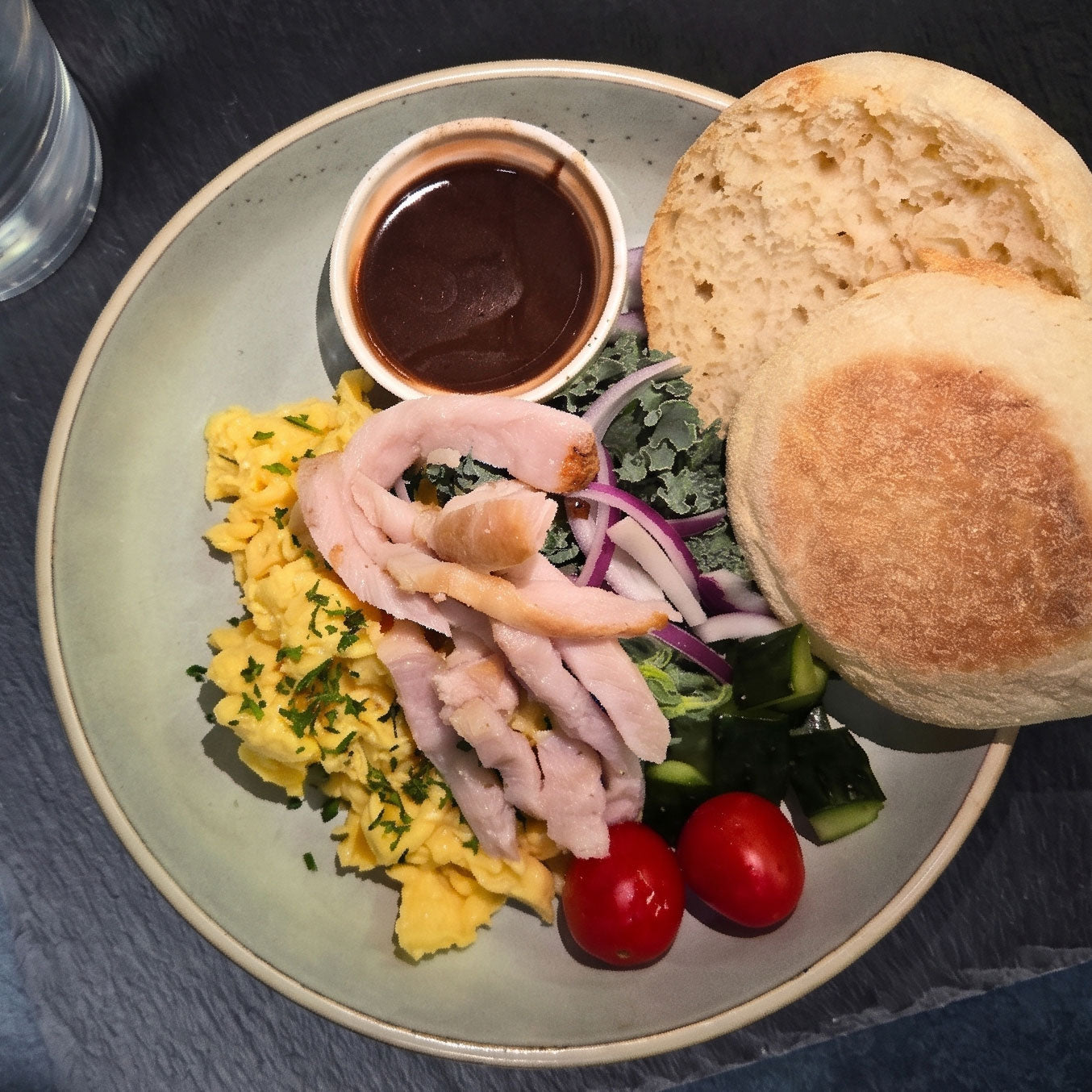 Texas Style Eggs w/ Pork Loin Muffin and Balsamic Kale Salad